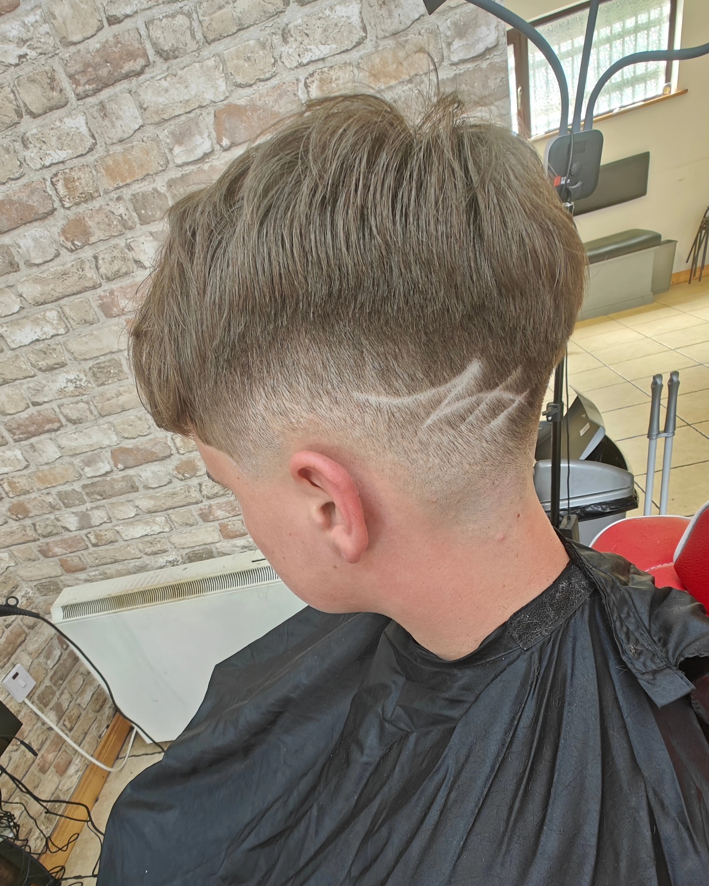 Prestige Barbers — fade with carved design